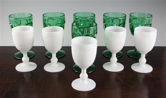 A set of six Victorian green press moulded glass goblets and five similar opaque white glass goblets, 17.5 and 15.5cm